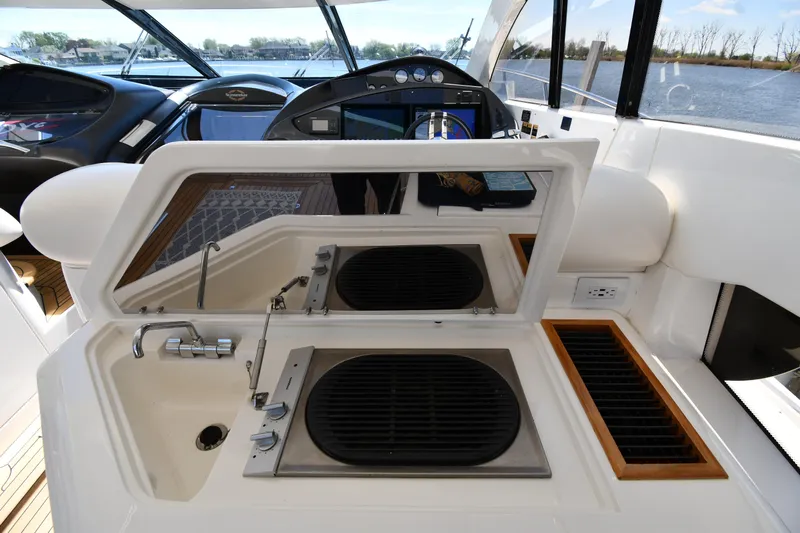 Loudmouth Soup Yacht Photos Pics Sunseeker 68 Predator 2002 yacht interior with sink and grill station.