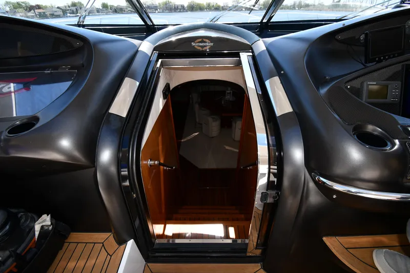 Loudmouth Soup Yacht Photos Pics Interior view of 2002 Sunseeker 68 Predator yacht, featuring sleek design and wooden accents.