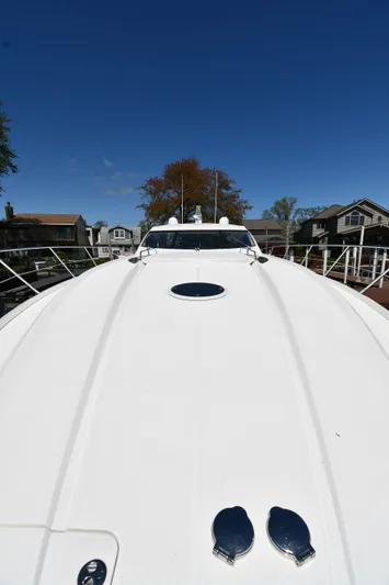 Loudmouth Soup Yacht Photos Pics 2002 Sunseeker 68 Predator yacht deck under clear blue sky.