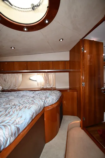 Loudmouth Soup Yacht Photos Pics Luxurious cabin interior of 2002 Sunseeker 68 Predator yacht with wood finishes.