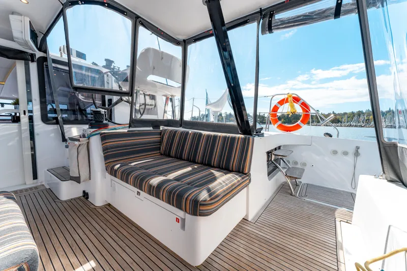 Wikiwiki Yacht Photos Pics 2018 Outremer 5X yacht interior with striped seating and panoramic windows.