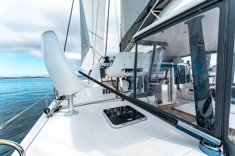 Wikiwiki Yacht Photos Pics 2018 Outremer 5X catamaran deck with sails, showcasing sleek design and ocean view.