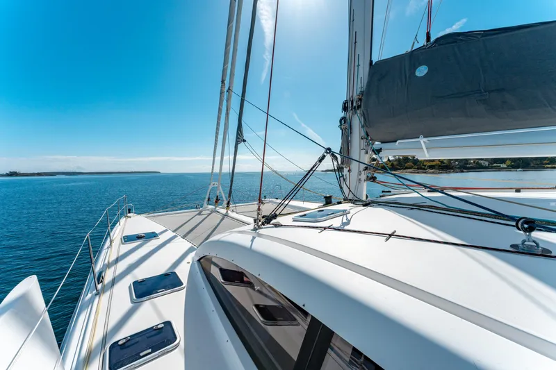 Wikiwiki Yacht Photos Pics Outremer 5X 2018 catamaran sailing on a sunny day, showcasing sleek design and open sea.