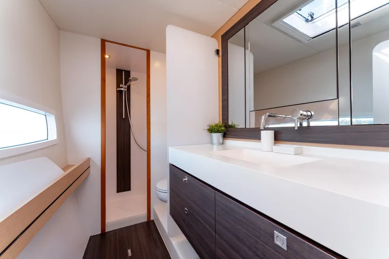 Wikiwiki Yacht Photos Pics Luxurious bathroom interior of 2018 Outremer 5X yacht with modern fixtures and sleek design.
