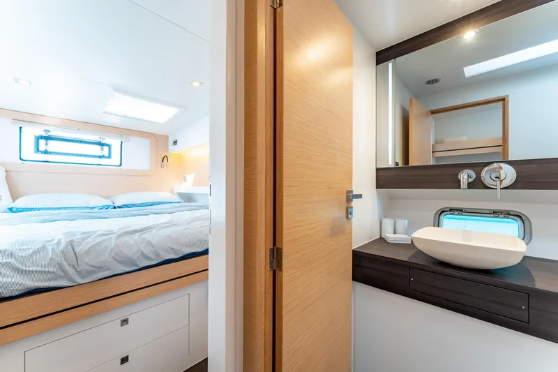 Wikiwiki Yacht Photos Pics Luxurious 2018 Outremer 5X yacht interior with bedroom and modern bathroom.