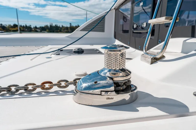 Wikiwiki Yacht Photos Pics Outremer 5X 2018 yacht deck with anchor chain and winch under clear sky.