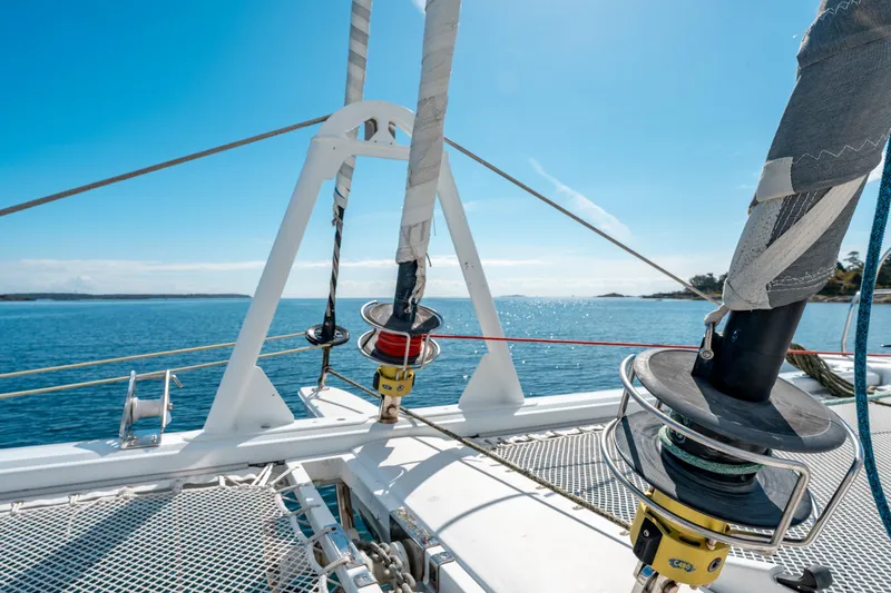Wikiwiki Yacht Photos Pics 2018 Outremer 5X catamaran deck with ropes and winches, sailing on a sunny day.