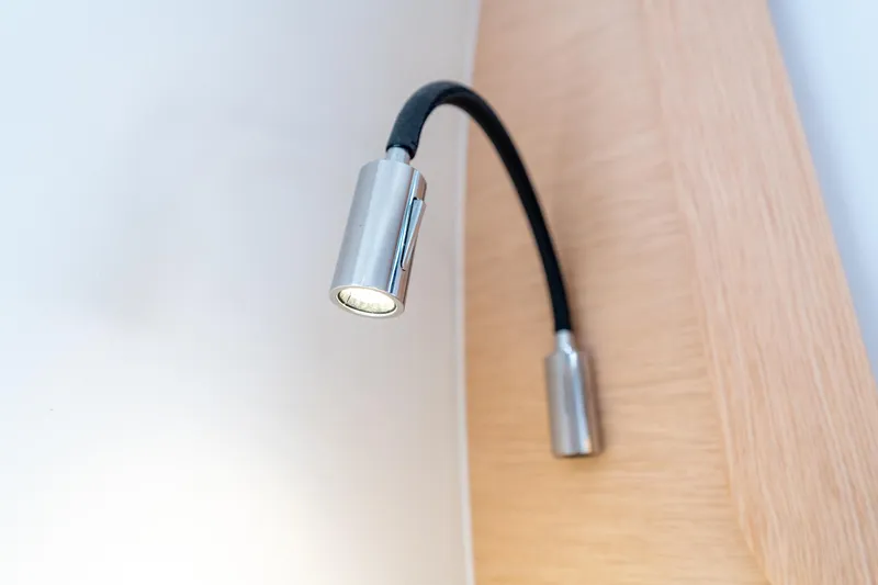 Wikiwiki Yacht Photos Pics Flexible reading light on Outremer 5X yacht, 2018 model, mounted on wooden panel.