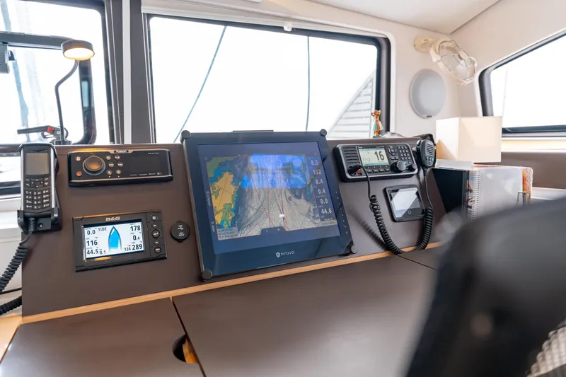Wikiwiki Yacht Photos Pics Navigation equipment on 2018 Outremer 5X catamaran, featuring GPS and communication devices.