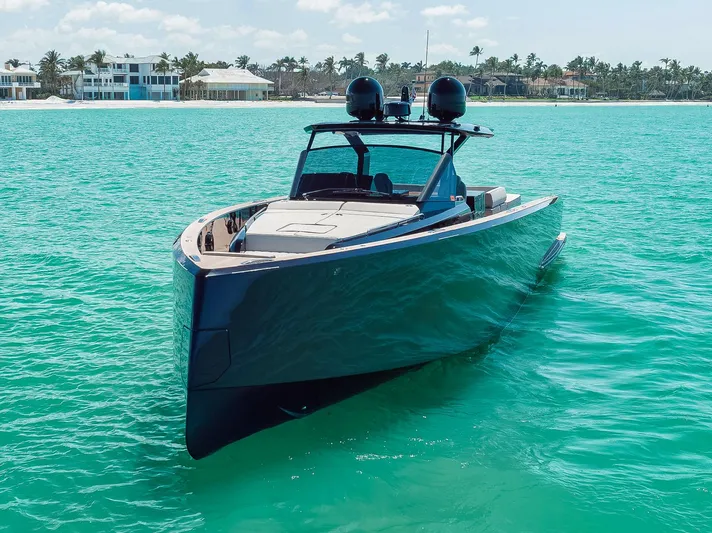 Ciao Yacht Photos Pics 2023 Pardo Yachts 50 Pardo cruising in turquoise waters near luxury beachfront homes.