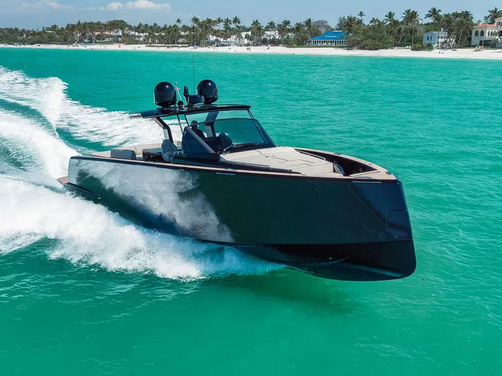 Ciao Yacht Photos Pics 2023 Pardo Yachts 50 cruising in turquoise waters near a tropical beach.