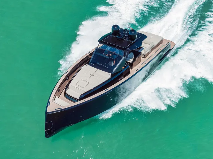 Ciao Yacht Photos Pics 2023 Pardo Yachts 50 Pardo cruising on turquoise water, showcasing sleek design and luxury.