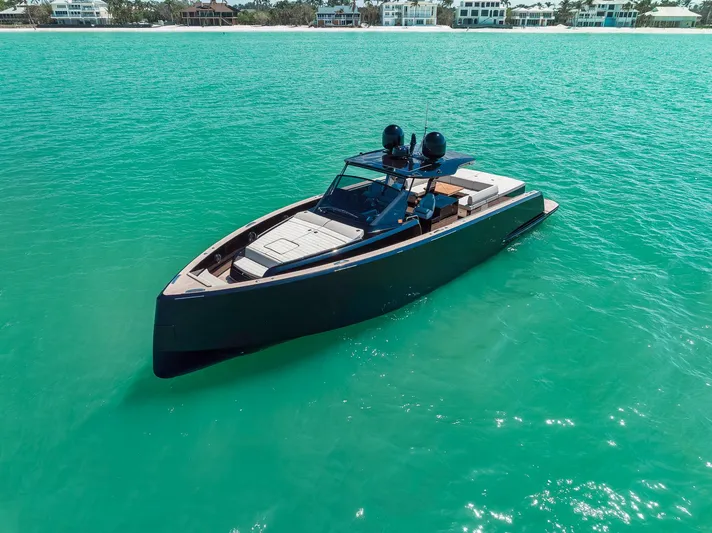 Ciao Yacht Photos Pics 2023 Pardo Yachts 50 Pardo cruising on turquoise waters near luxury beachfront homes.