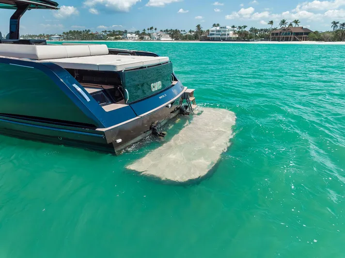 Ciao Yacht Photos Pics 2023 Pardo Yachts 50 Pardo in turquoise waters, showcasing sleek design and luxury features.