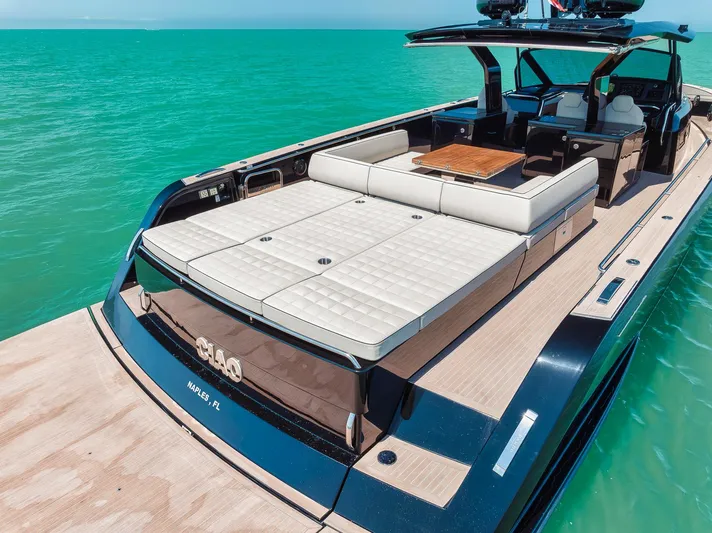Ciao Yacht Photos Pics 2023 Pardo Yachts 50 Pardo luxury yacht on turquoise water, featuring spacious deck and seating.