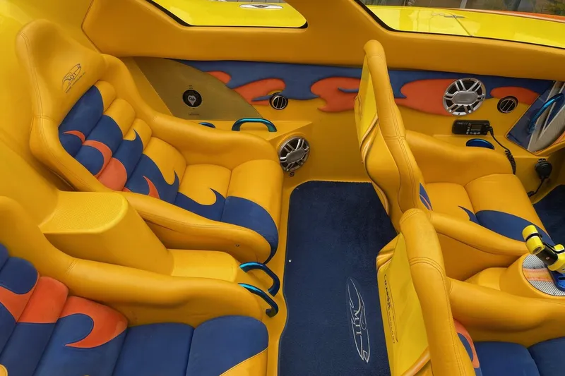  Yacht Photos Pics Vibrant yellow and blue interior of a 2007 MTI 40RP boat with custom seating.