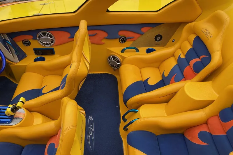  Yacht Photos Pics Vibrant yellow and blue interior of a 2007 MTI 40RP boat with custom seating.