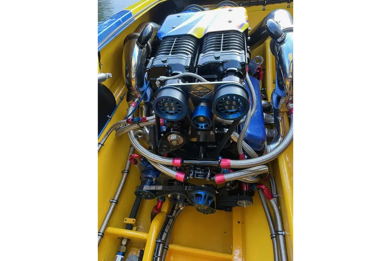  Yacht Photos Pics High-performance engine in a 2007 MTI 40RP boat, featuring intricate piping and components.