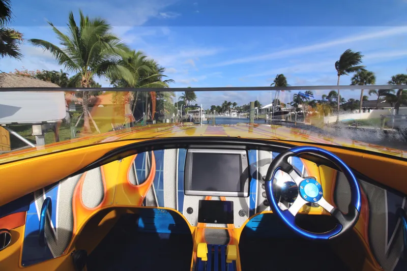  Yacht Photos Pics Interior view of a 2007 MTI 40RP boat with vibrant dashboard and steering wheel.