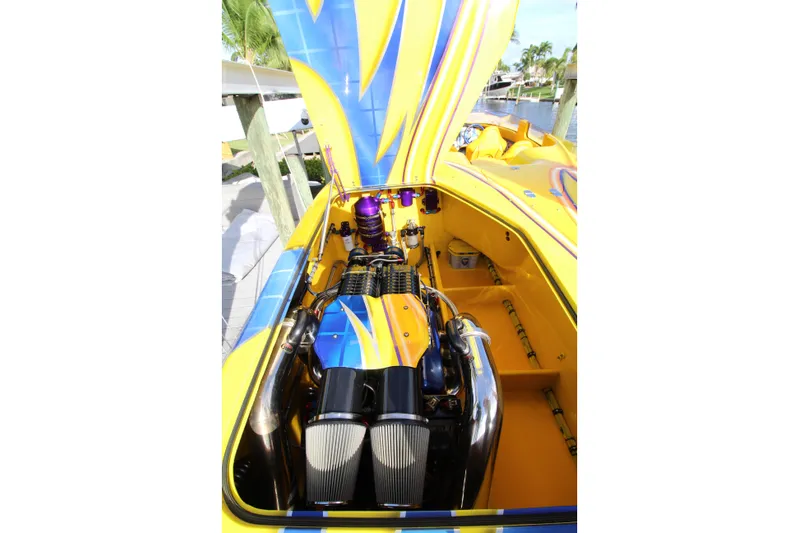  Yacht Photos Pics Yellow and blue 2007 MTI 40RP boat engine with vibrant design.