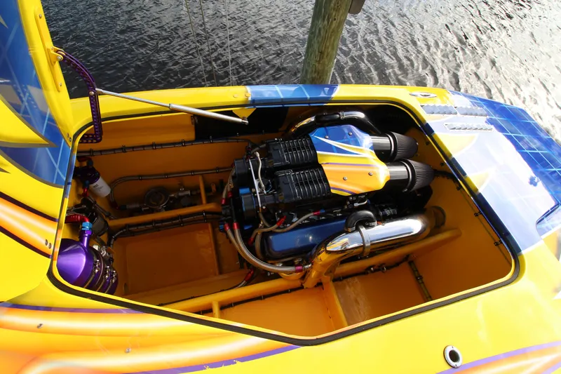  Yacht Photos Pics 2007 MTI 40RP boat engine compartment with vibrant yellow and blue design.