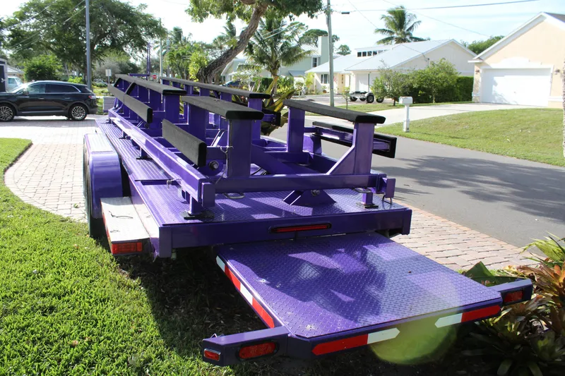  Yacht Photos Pics Purple 2007 MTI 40RP trailer parked on a residential street.