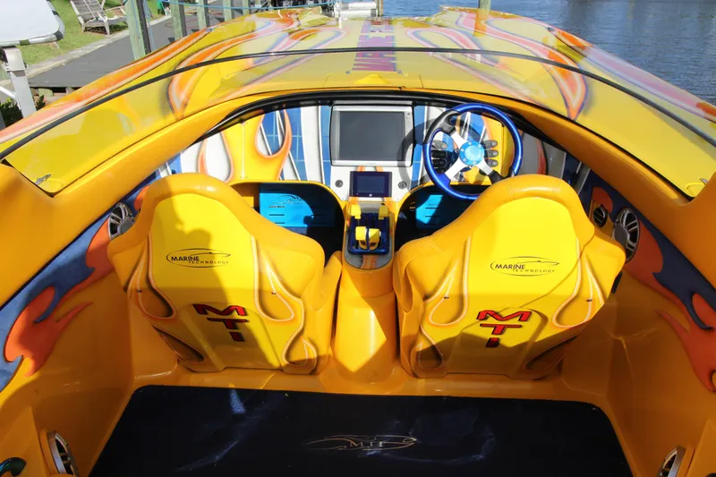  Yacht Photos Pics 2007 MTI 40RP boat interior with vibrant yellow seats and modern dashboard.