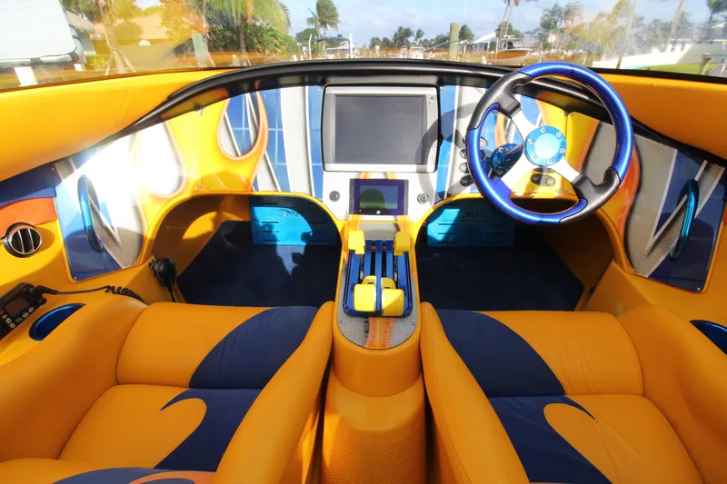  Yacht Photos Pics Vibrant interior of 2007 MTI 40RP boat with yellow and blue accents.