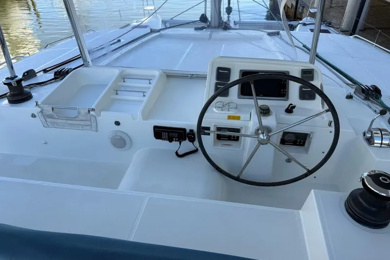 Tomcat Yacht Photos Pics Helm of 2012 Lagoon 450 F catamaran with steering wheel and navigation controls.