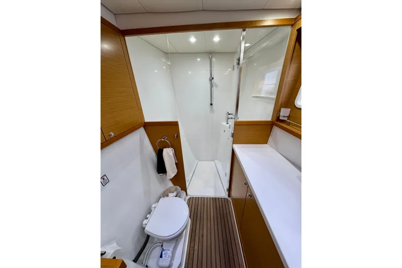 Tomcat Yacht Photos Pics Luxurious bathroom in 2012 Lagoon 450 F yacht with shower and wooden accents.
