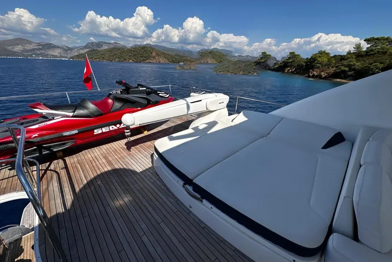  Yacht Photos Pics 2016 Princess 88 Motor Yacht deck with jet ski, scenic ocean view, and sunbed.