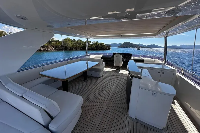  Yacht Photos Pics Luxurious 2016 Princess 88 Motor Yacht deck with seating, table, and scenic ocean view.