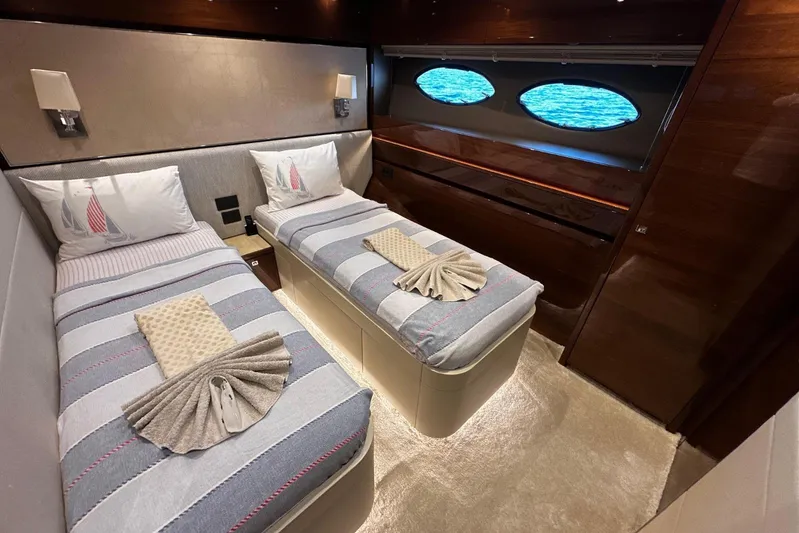  Yacht Photos Pics Luxurious twin cabin interior on 2016 Princess 88 Motor Yacht with elegant bedding and ocean view.