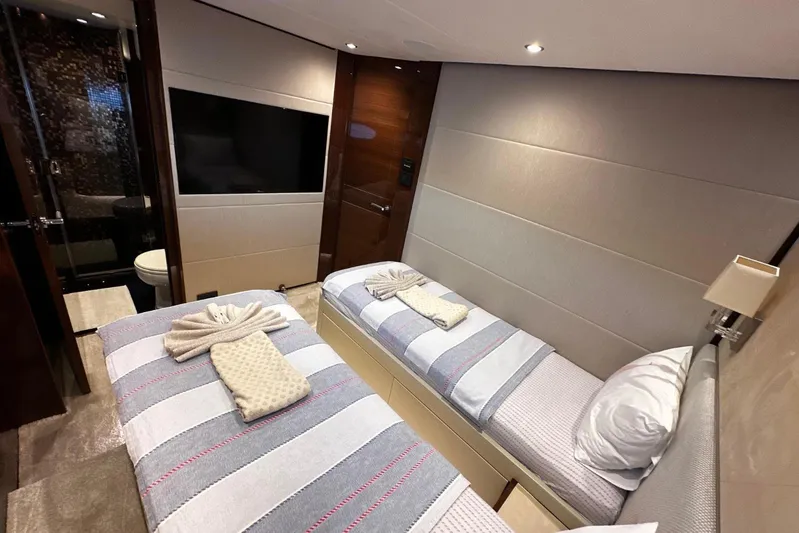  Yacht Photos Pics Luxurious twin bedroom on 2016 Princess 88 Motor Yacht with modern decor and amenities.