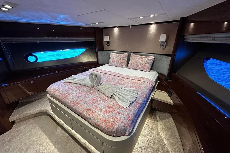  Yacht Photos Pics Luxurious bedroom interior of 2016 Princess 88 Motor Yacht with elegant bedding and ambient lighting.