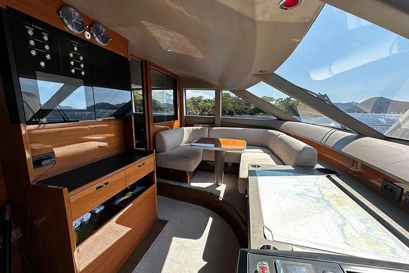  Yacht Photos Pics Luxurious interior of 2016 Princess 88 Motor Yacht with panoramic windows and elegant seating.