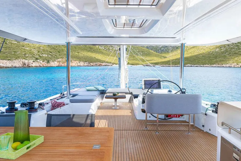  Yacht Photos Pics Manufacturer Provided Image: Luxurious Lagoon 60 yacht interior, 2025 model, with scenic ocean view and modern amenities.