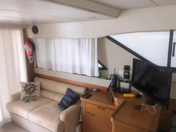  Yacht Photos Pics Interior of a 1991 Princess 388 yacht with sofa and TV.