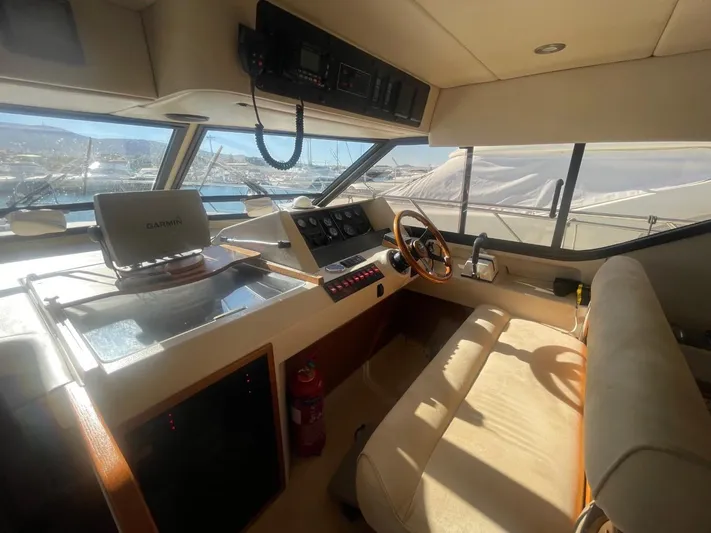  Yacht Photos Pics Interior of a 1991 Princess 388 yacht with helm station.