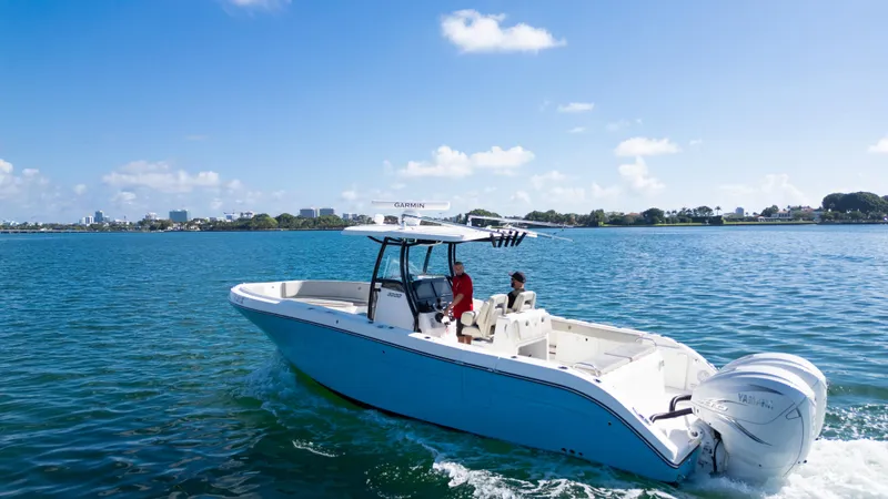  Yacht Photos Pics 2019 Century 3200 Center Console boat cruising on a sunny day.