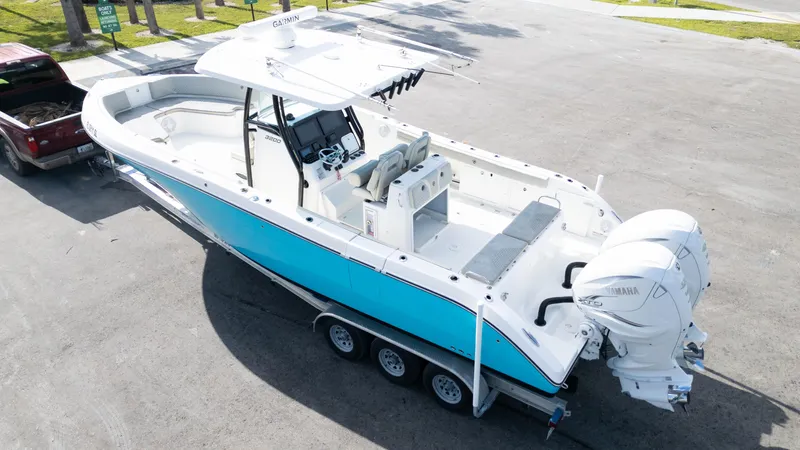  Yacht Photos Pics 2019 Century 3200 Center Console boat on trailer, featuring dual outboard engines.