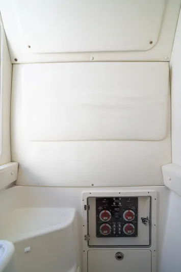  Yacht Photos Pics 2019 Century 3200 Center Console interior with control panel and white upholstery.
