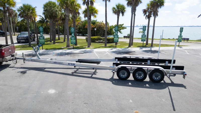  Yacht Photos Pics Trailer for 2019 Century 3200 Center Console boat, parked near palm trees by the water.