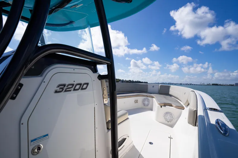  Yacht Photos Pics 2019 Century 3200 Center Console boat on water under blue sky.