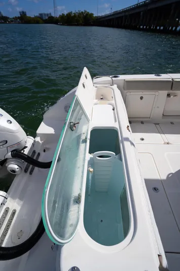  Yacht Photos Pics 2019 Century 3200 Center Console boat with open storage compartment on deck.