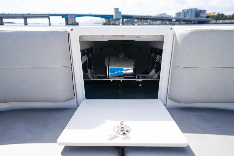  Yacht Photos Pics 2019 Century 3200 Center Console boat interior with open storage compartment and table.