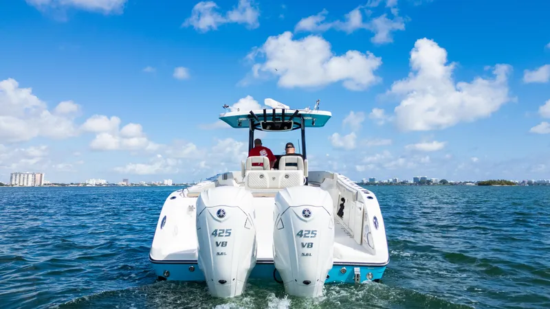  Yacht Photos Pics 2019 Century 3200 Center Console boat on open water under blue sky.