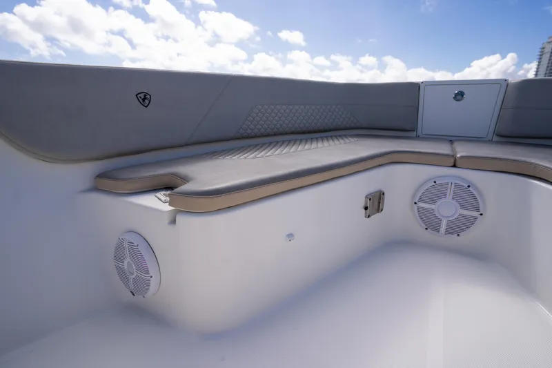  Yacht Photos Pics 2019 Century 3200 Center Console boat interior with cushioned seating and speakers.