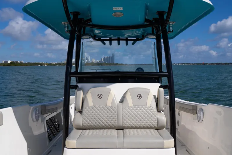  Yacht Photos Pics 2019 Century 3200 Center Console boat interior with cushioned seating, ocean view.