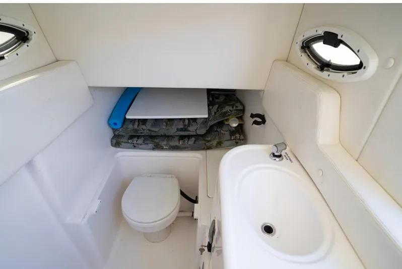  Yacht Photos Pics 2019 Century 3200 Center Console boat interior with toilet and sink.